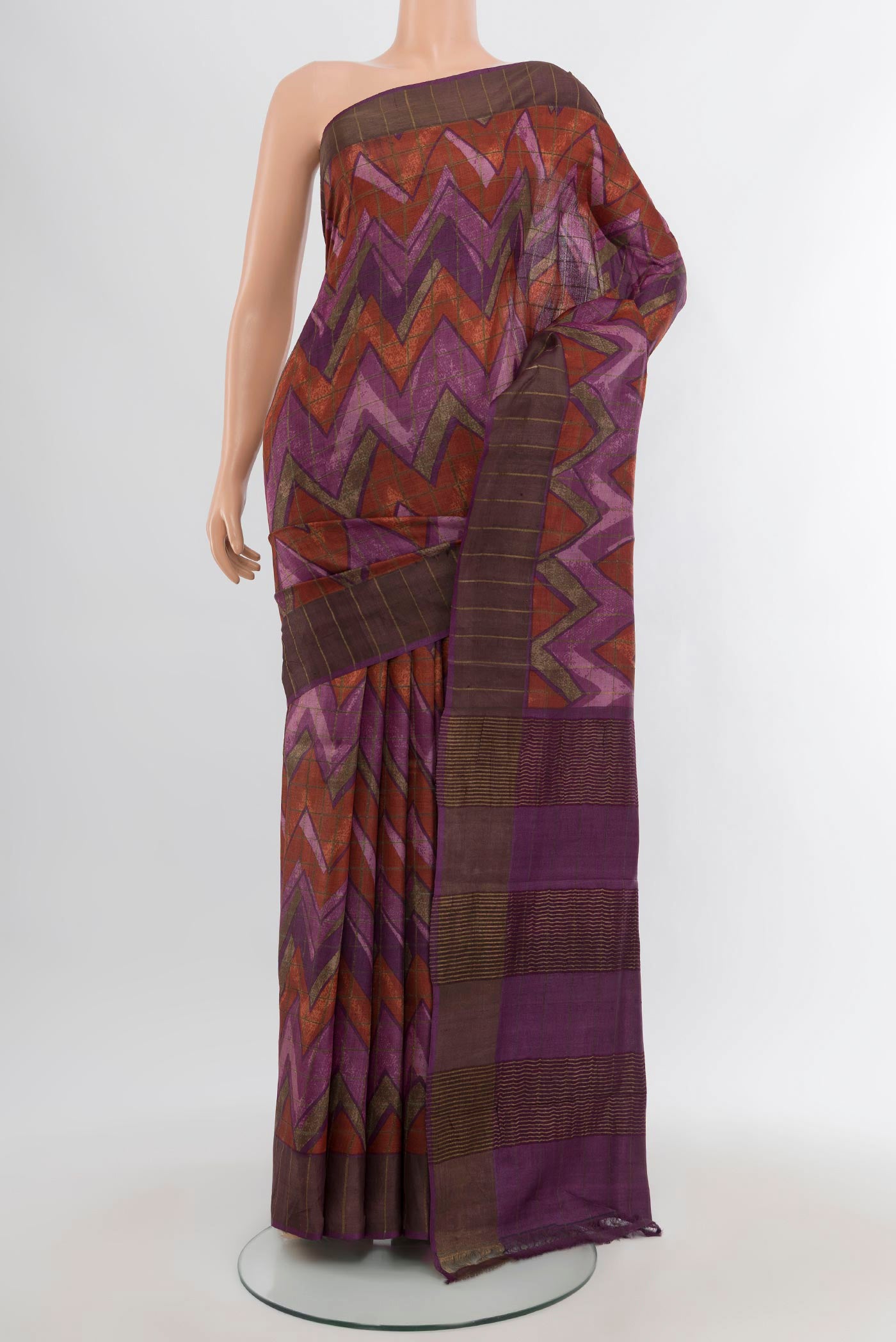 Purple Tussar Silk Saree with Geometric Print on the body and Zari Border.  displayed on a mannequin