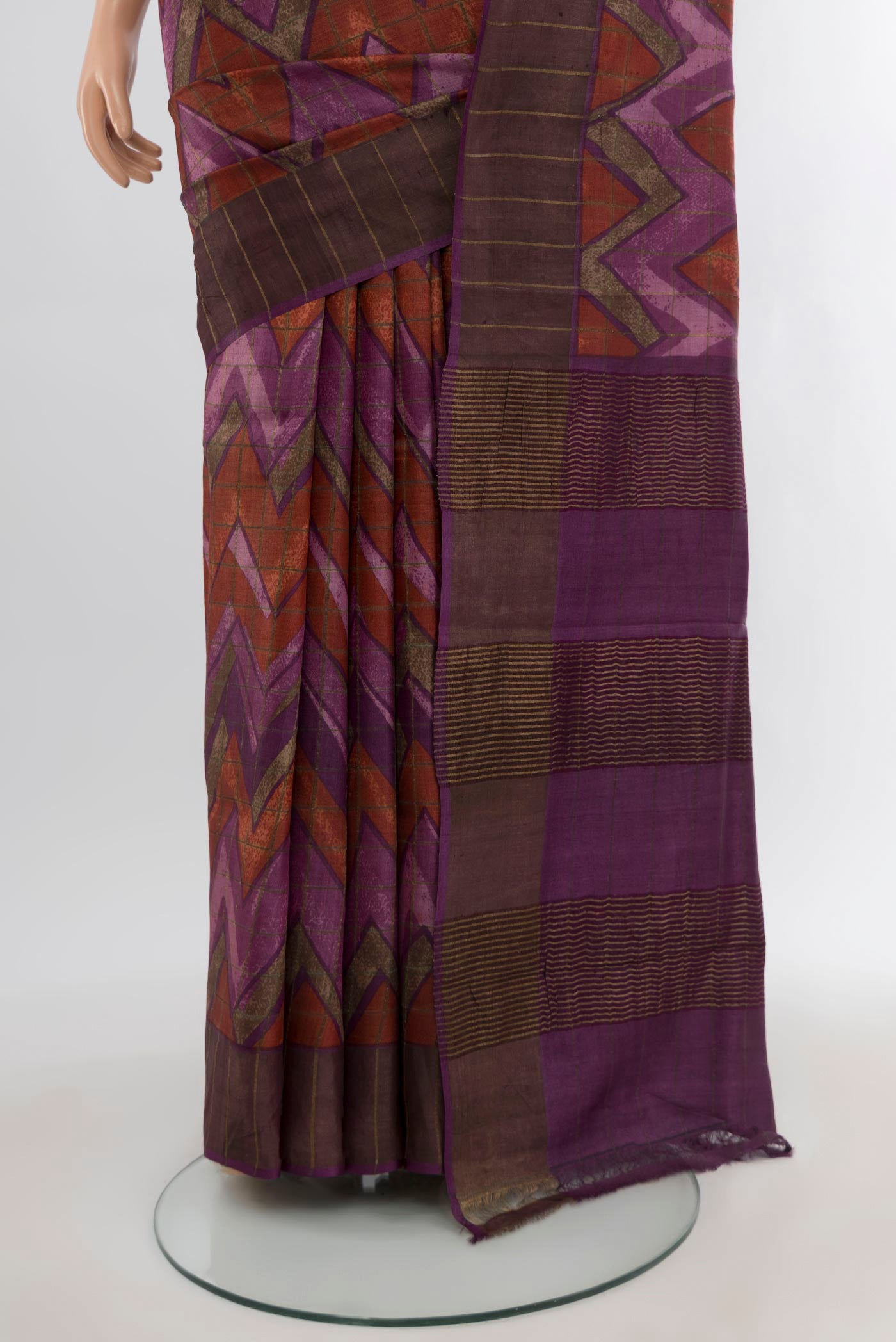 Pleats and pallu of Purple Tussar Silk Saree with Geometric Print on the body and Zari Border. 