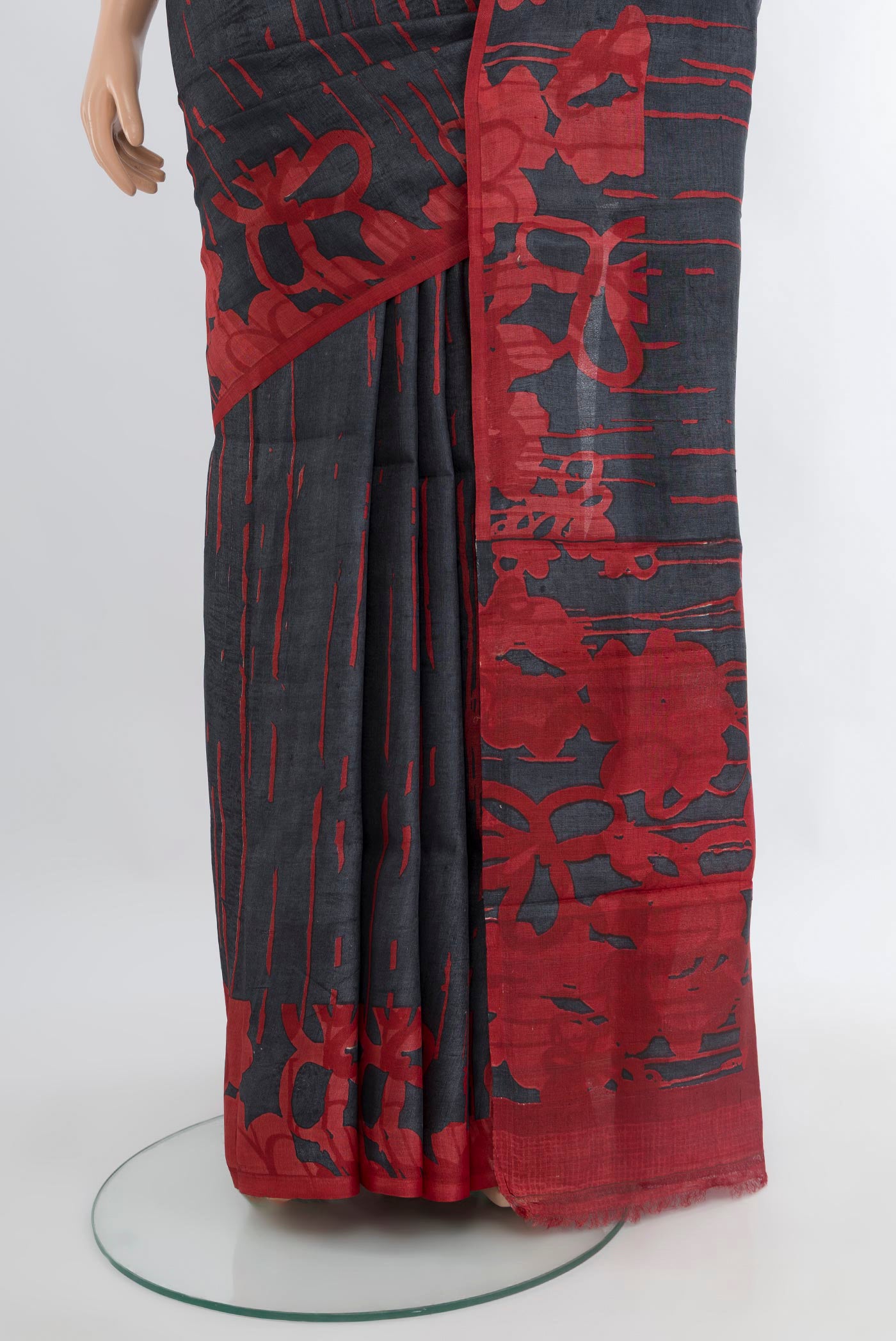 Pleats and pallu of Black Tussar Silk Saree with Floral Print on the body and Without Border. 