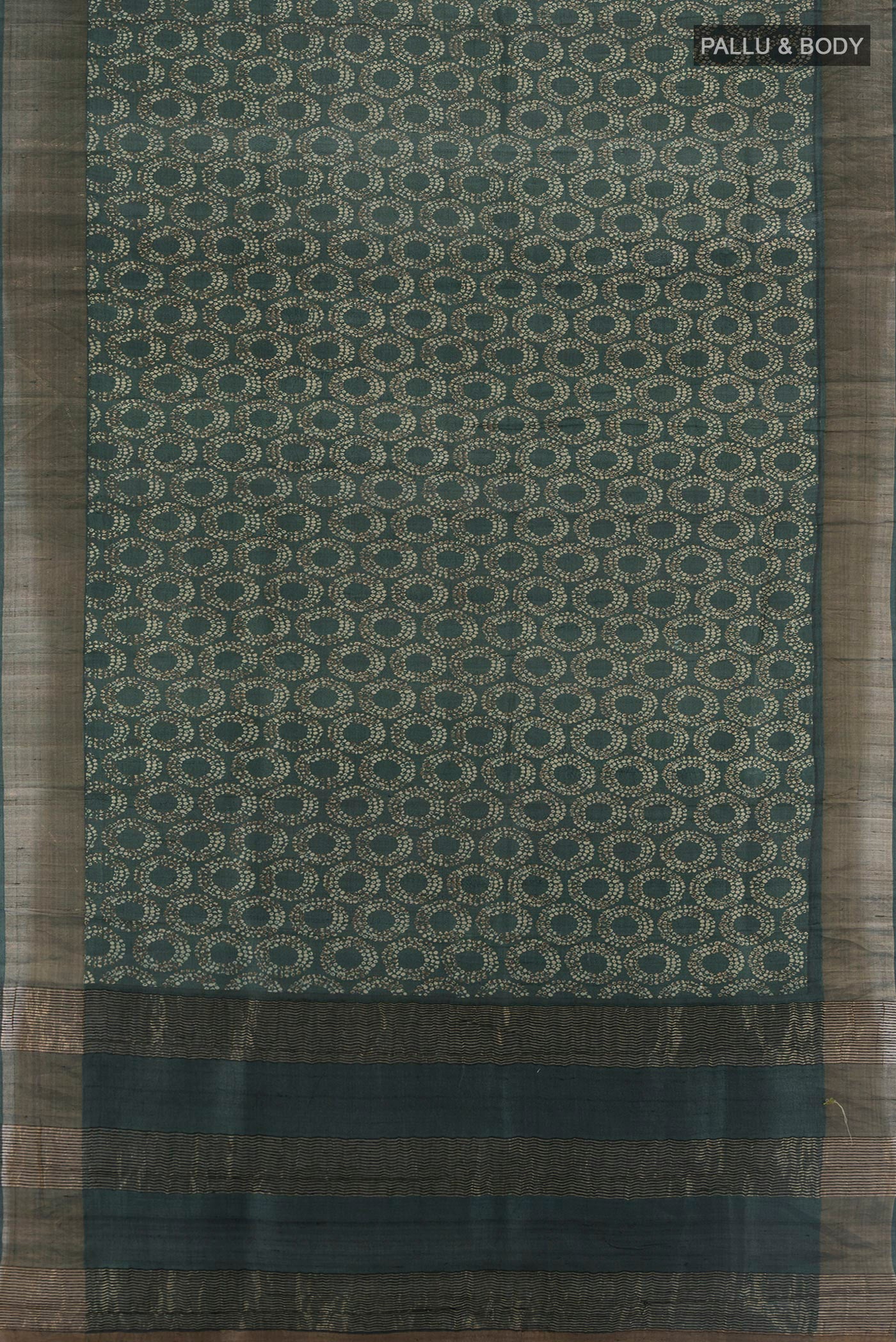 Flat view of Bottle Green Tussar Silk Saree with Floral Print on the body and Zari Border. 
