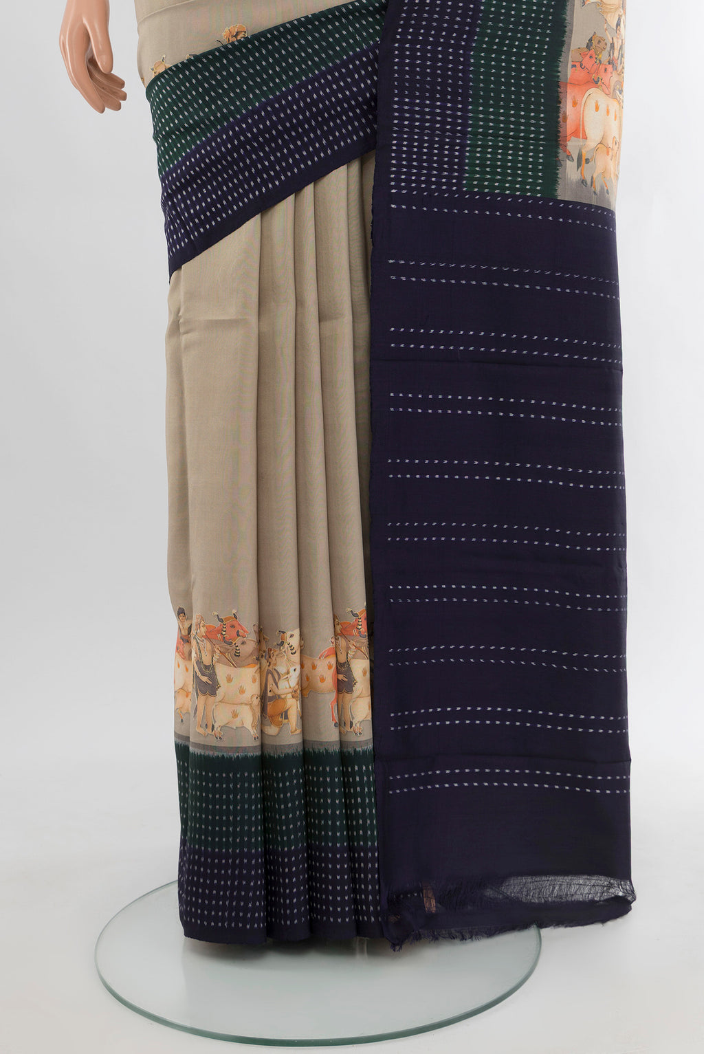 Pleats and pallu of Beige Tussar Silk Saree with Plain Body and Printed Border. 