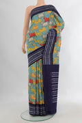 Pure Silk Light Blue Printed Saree with Printed design on the body and Ikat Border.  displayed on a mannequin