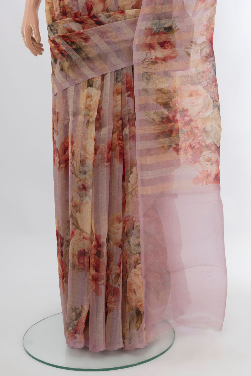 Pleats and pallu of Lavender Organza Silk Saree with Floral Print on the body and Without Border. 