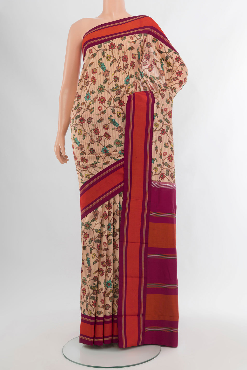 Sandal Printed Silk Saree with Floral Print on the body and Plain Border.  displayed on a mannequin
