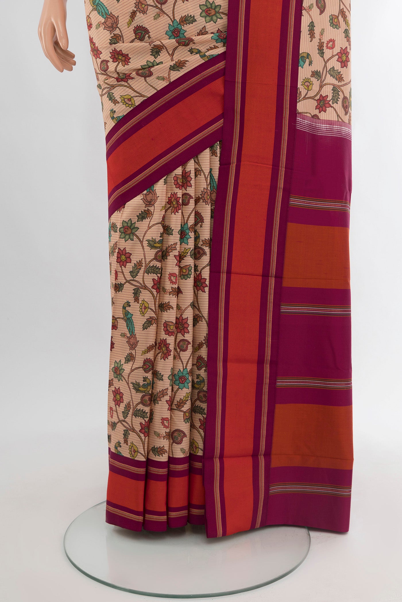 Pleats and pallu of Sandal Printed Silk Saree with Floral Print on the body and Plain Border. 