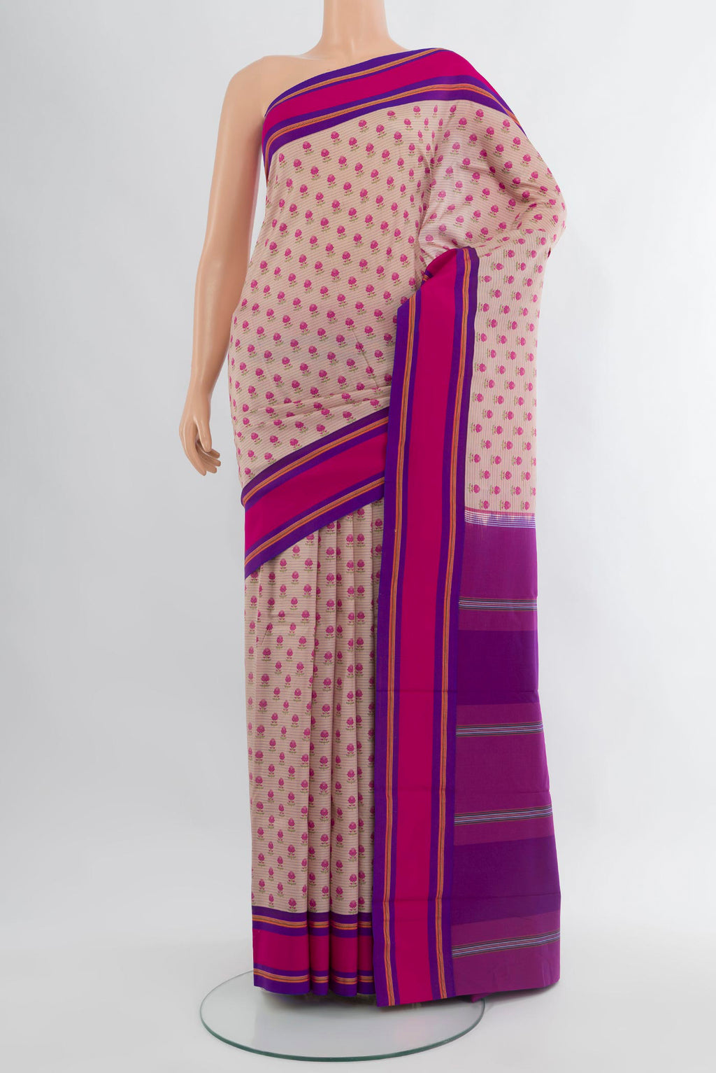 Rose Gold Kanchipuram Silk Saree with Floral Print on the body and Plain Border.  displayed on a mannequin