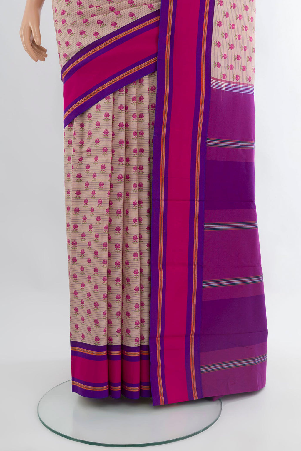 Pleats and pallu of Rose Gold Kanchipuram Silk Saree with Floral Print on the body and Plain Border. 
