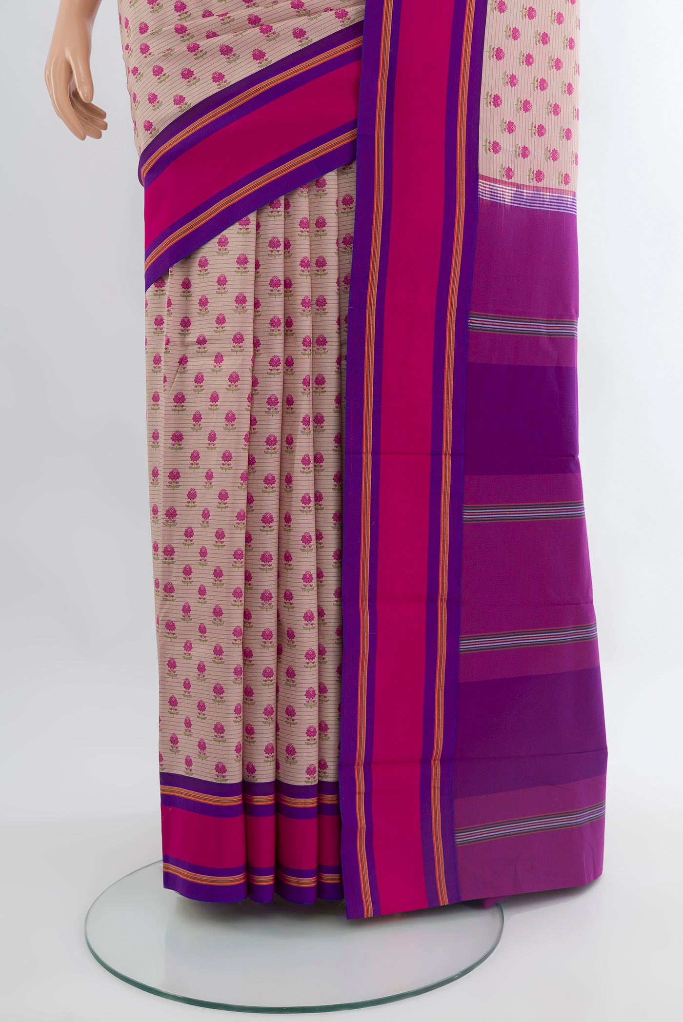 Pleats and pallu of Rose Gold Kanchipuram Silk Saree with Floral Print on the body and Plain Border. 