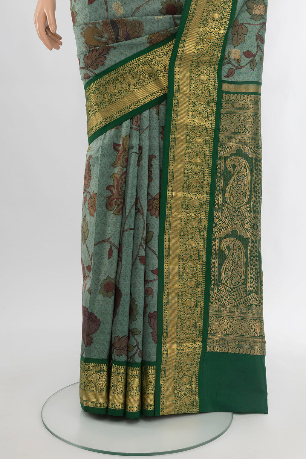Pleats and pallu of Green Printed Silk Saree with Floral Print on the body and Zari Border. 
