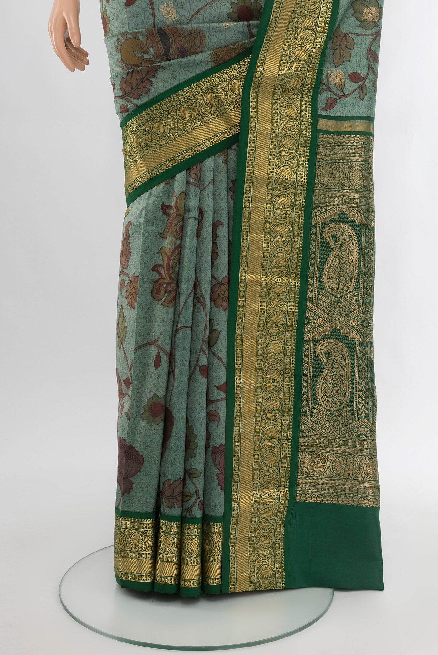 Pleats and pallu of Green Printed Silk Saree with Floral Print on the body and Zari Border. 