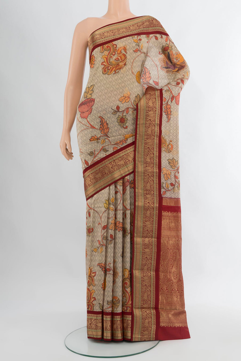 Beige Bangalore Silk Saree with Floral Print on the body and Zari Border.  displayed on a mannequin