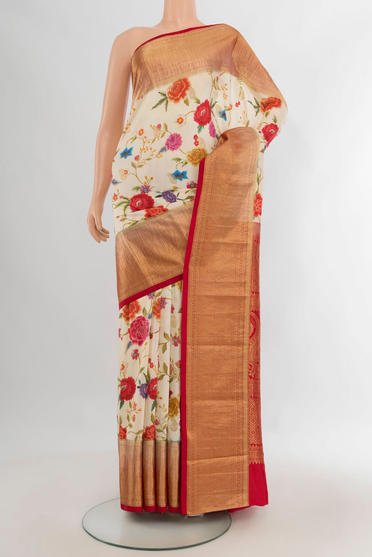 Pure Silk Cream Kanjivaram Saree with Floral Print on the body and Zari Border.  displayed on a mannequin