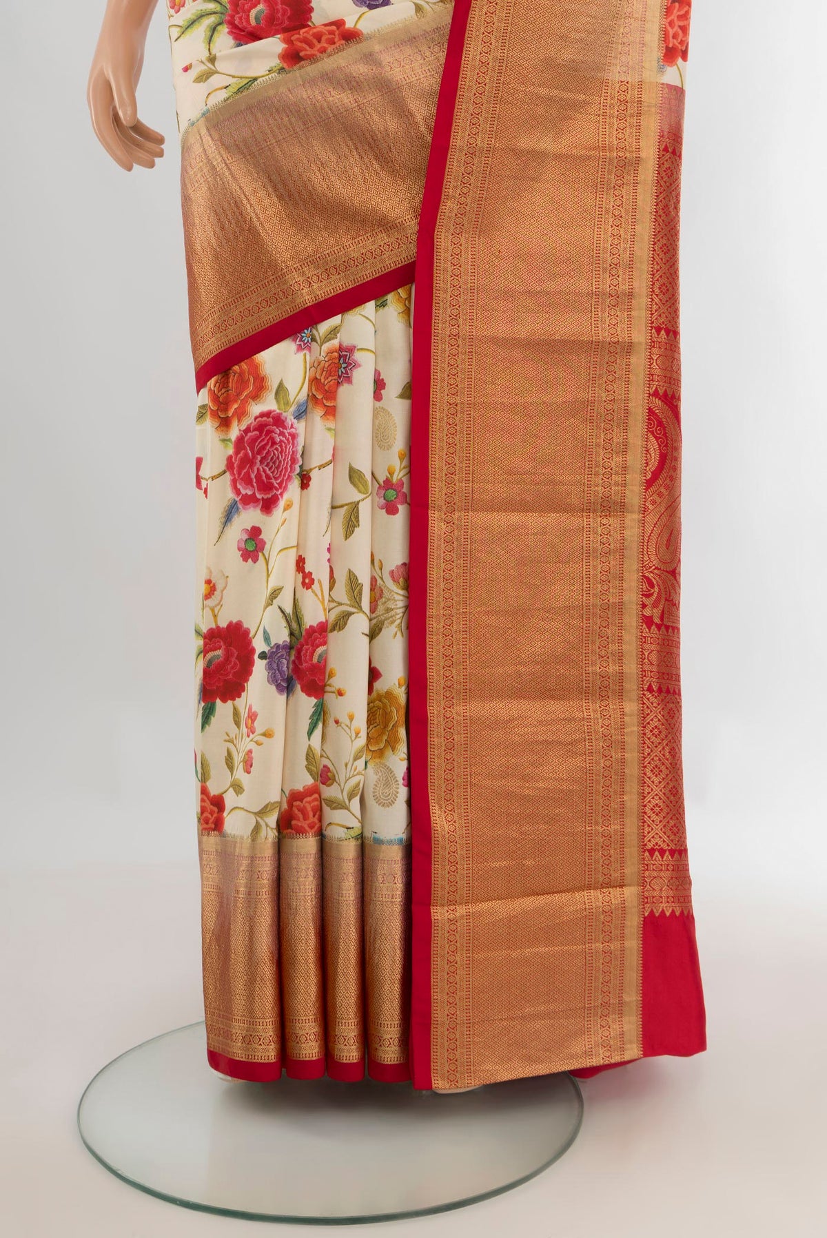 Pleats and pallu of Pure Silk Cream Kanjivaram Saree with Floral Print on the body and Zari Border. 