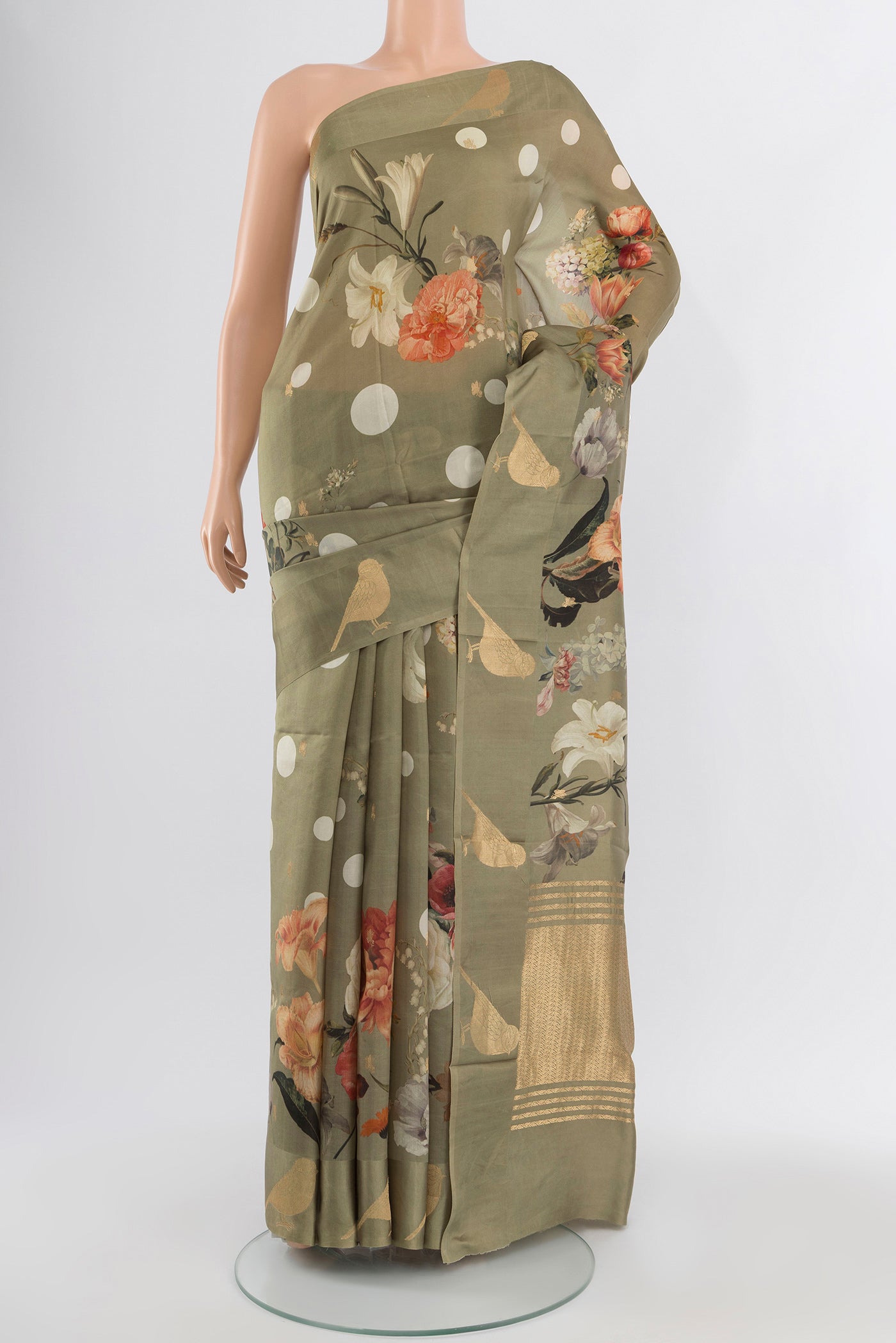 Sage Green Tussar Silk Saree with Floral Print on the body and Fancy Border.  displayed on a mannequin