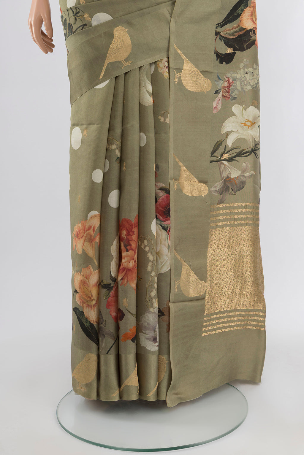 Pleats and pallu of Sage Green Tussar Silk Saree with Floral Print on the body and Fancy Border. 