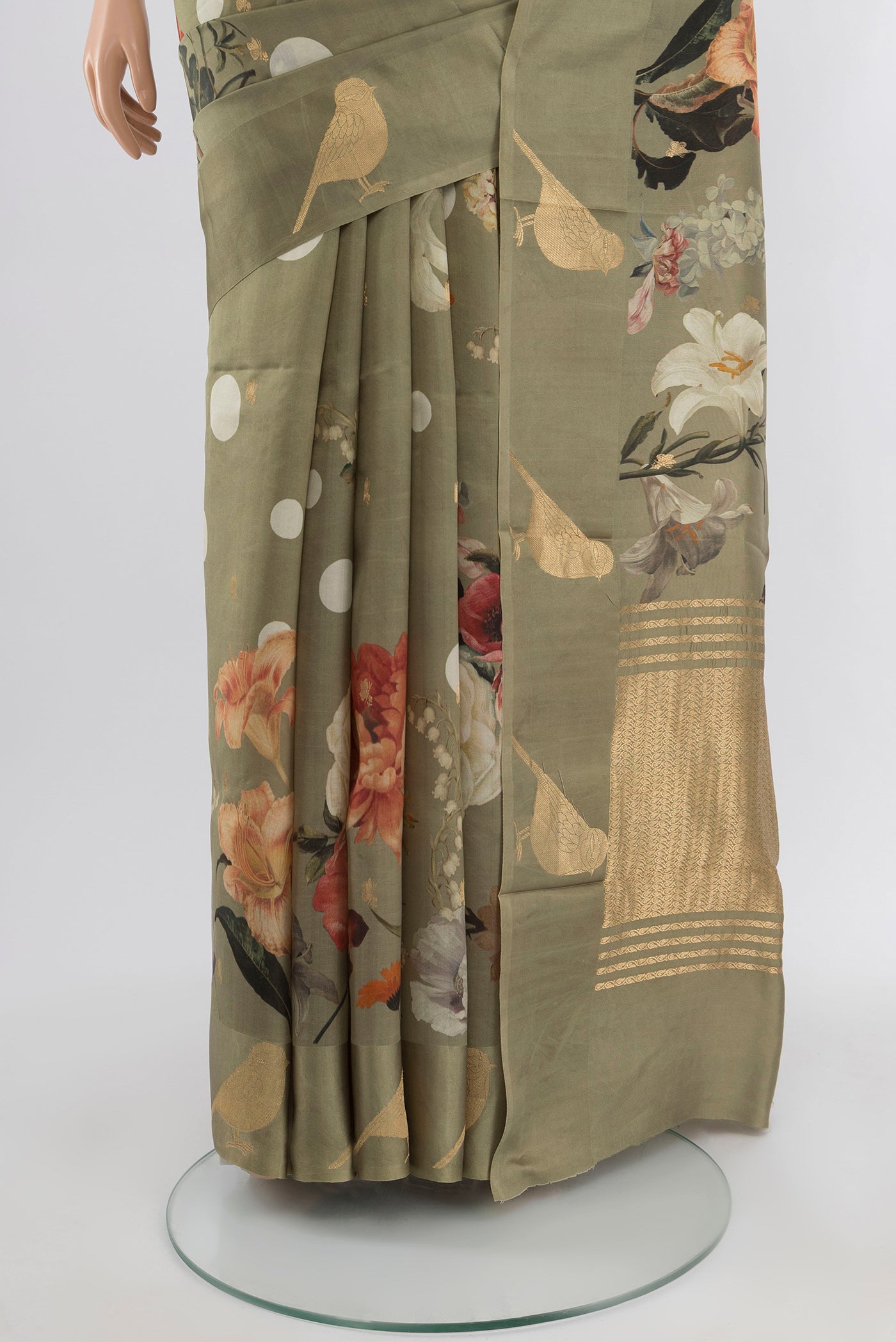 Pleats and pallu of Sage Green Tussar Silk Saree with Floral Print on the body and Fancy Border. 