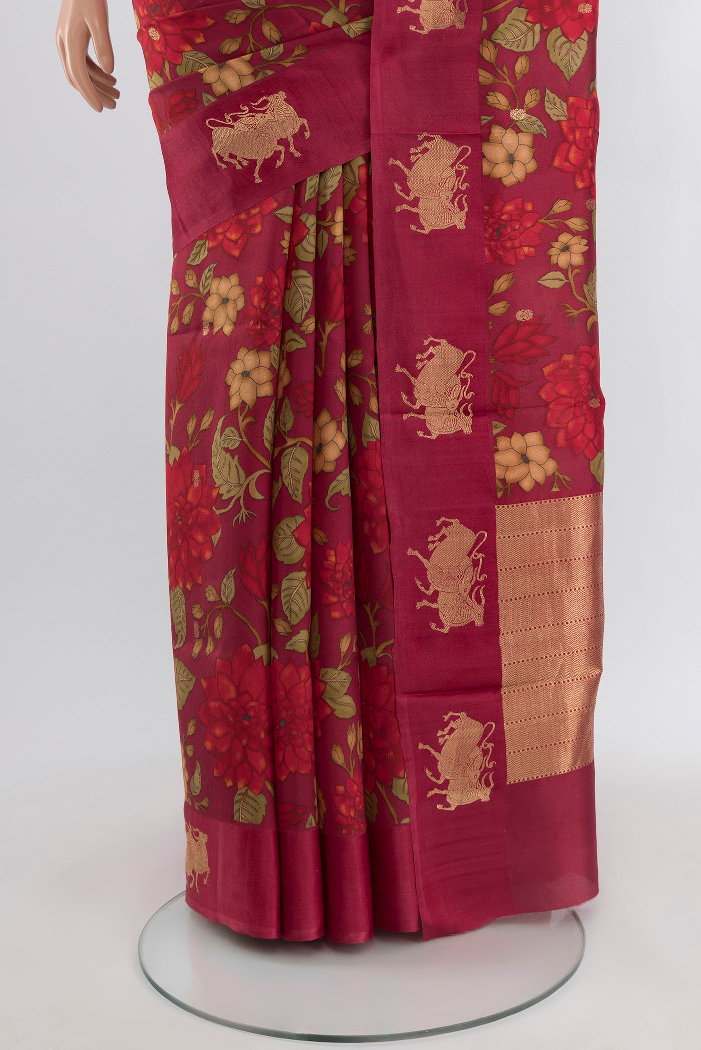 Pleats and pallu of Maroon Banarasi Katan Silk Saree with Floral Print on the body and Fancy Border. 