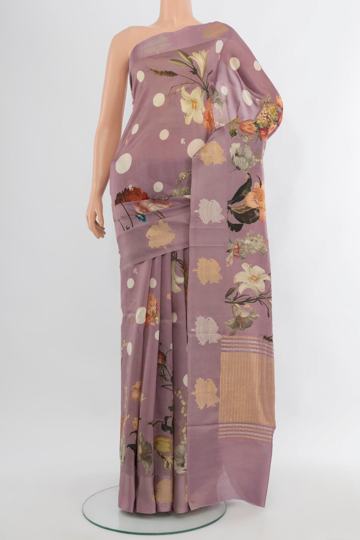 Lavender Banarasi Katan Silk Saree with Floral Print on the body and Fancy Border.  displayed on a mannequin