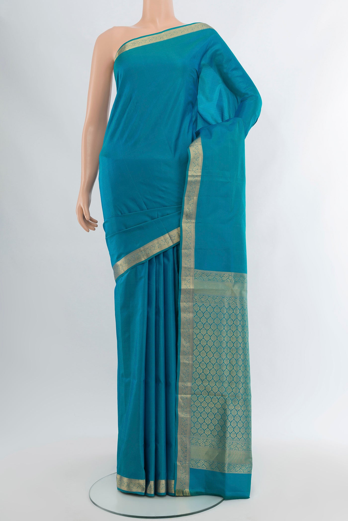 Light Blue Soft Silk Saree with Plain Body and Zari Border.  displayed on a mannequin