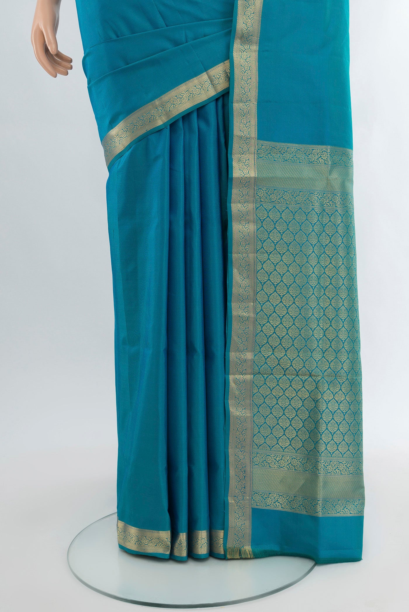 Pleats and pallu of Light Blue Soft Silk Saree with Plain Body and Zari Border. 