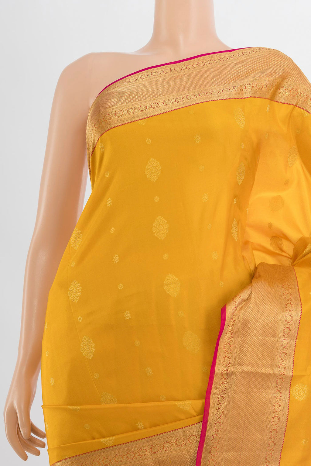 Border image of Mustard Soft Silk Saree with Zari Butta on the body and Silk Border. 
