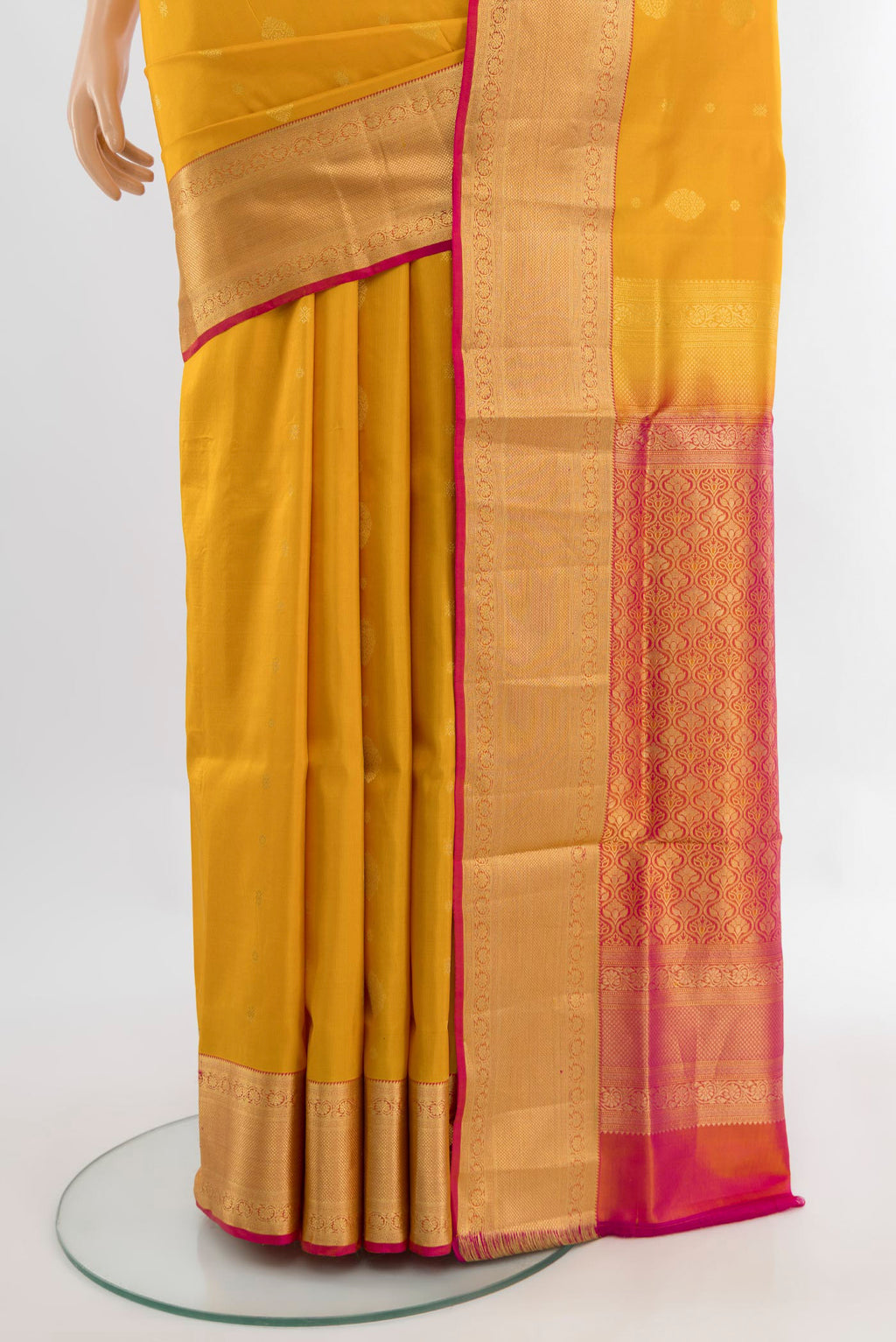 Pleats and pallu of Mustard Soft Silk Saree with Zari Butta on the body and Silk Border. 