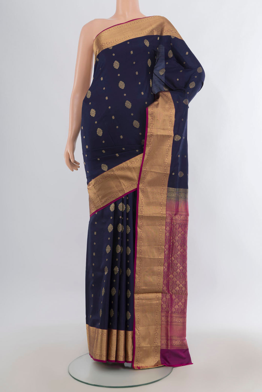 Pure Silk Navy Blue Soft Saree with Zari Butta on the body and Zari Border.  displayed on a mannequin