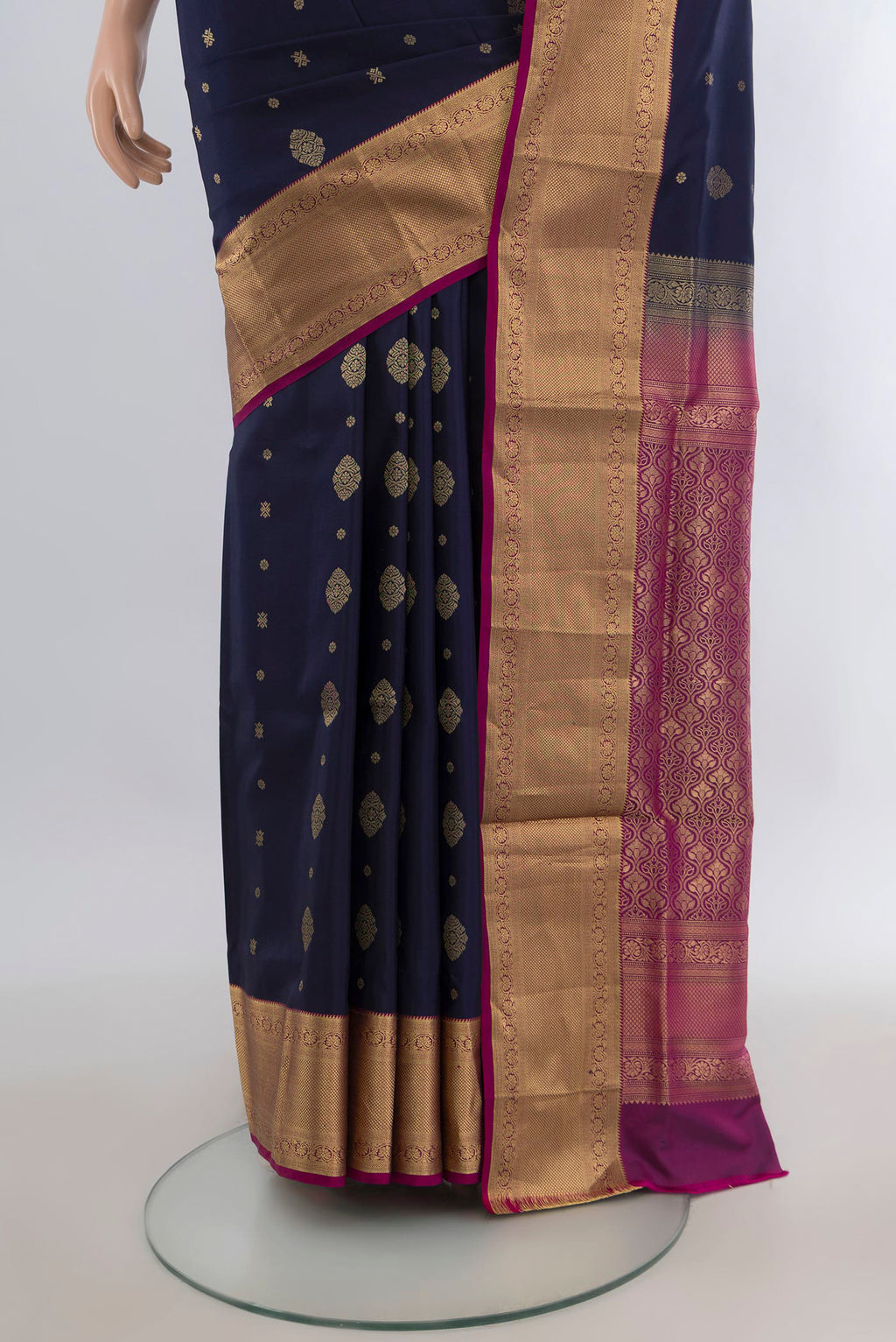 Pleats and pallu of Pure Silk Navy Blue Soft Saree with Zari Butta on the body and Zari Border. 