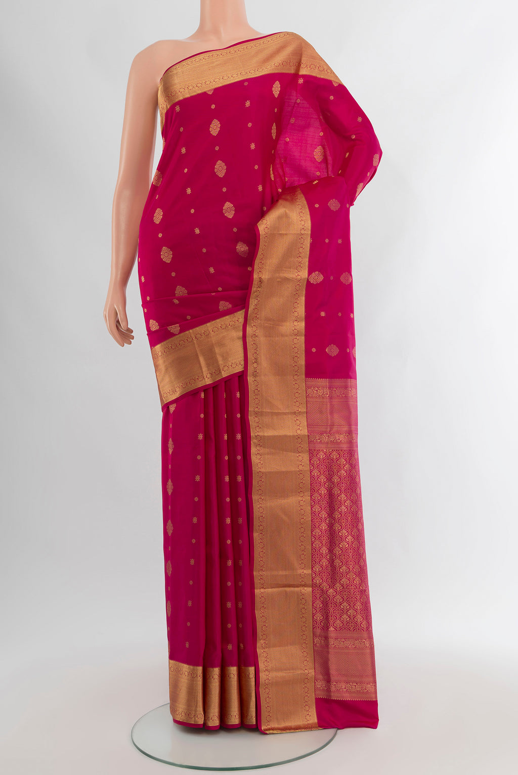 Dark Pink Soft Silk Saree with Zari Butta on the body and Zari Border.  displayed on a mannequin