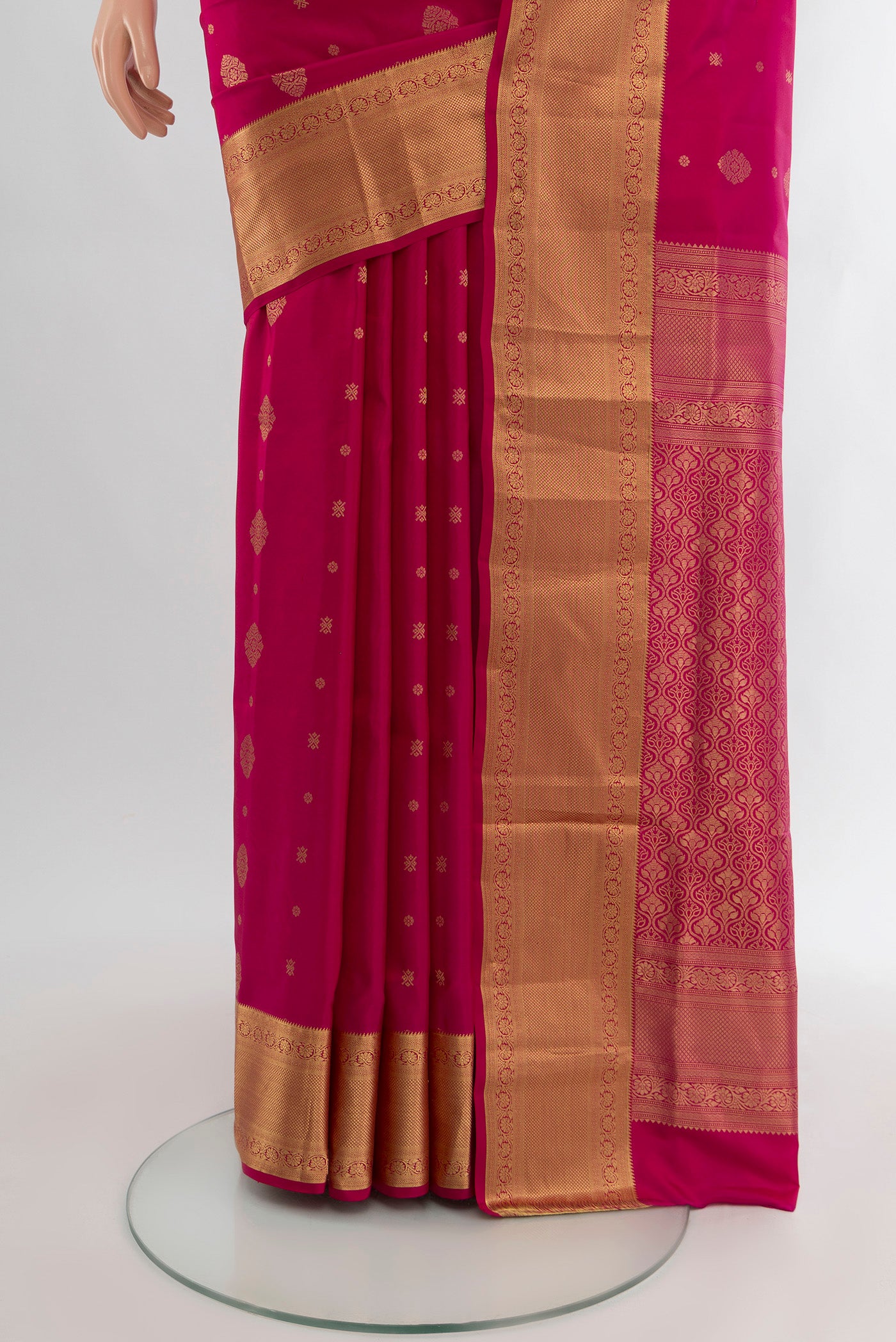 Pleats and pallu of Dark Pink Soft Silk Saree with Zari Butta on the body and Zari Border. 