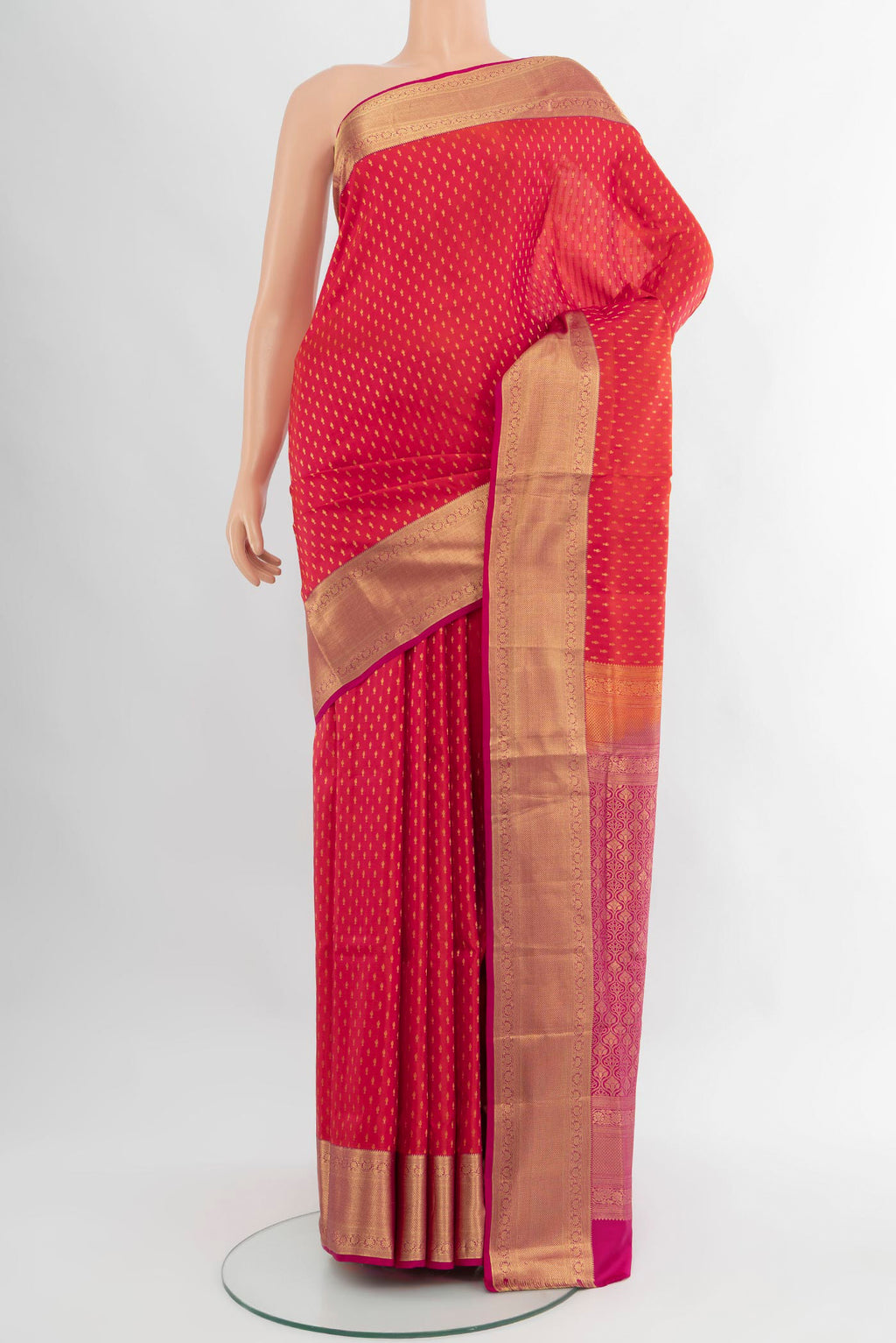 Coral Soft Silk Saree with Zari Butta on the body and Zari Border.  displayed on a mannequin