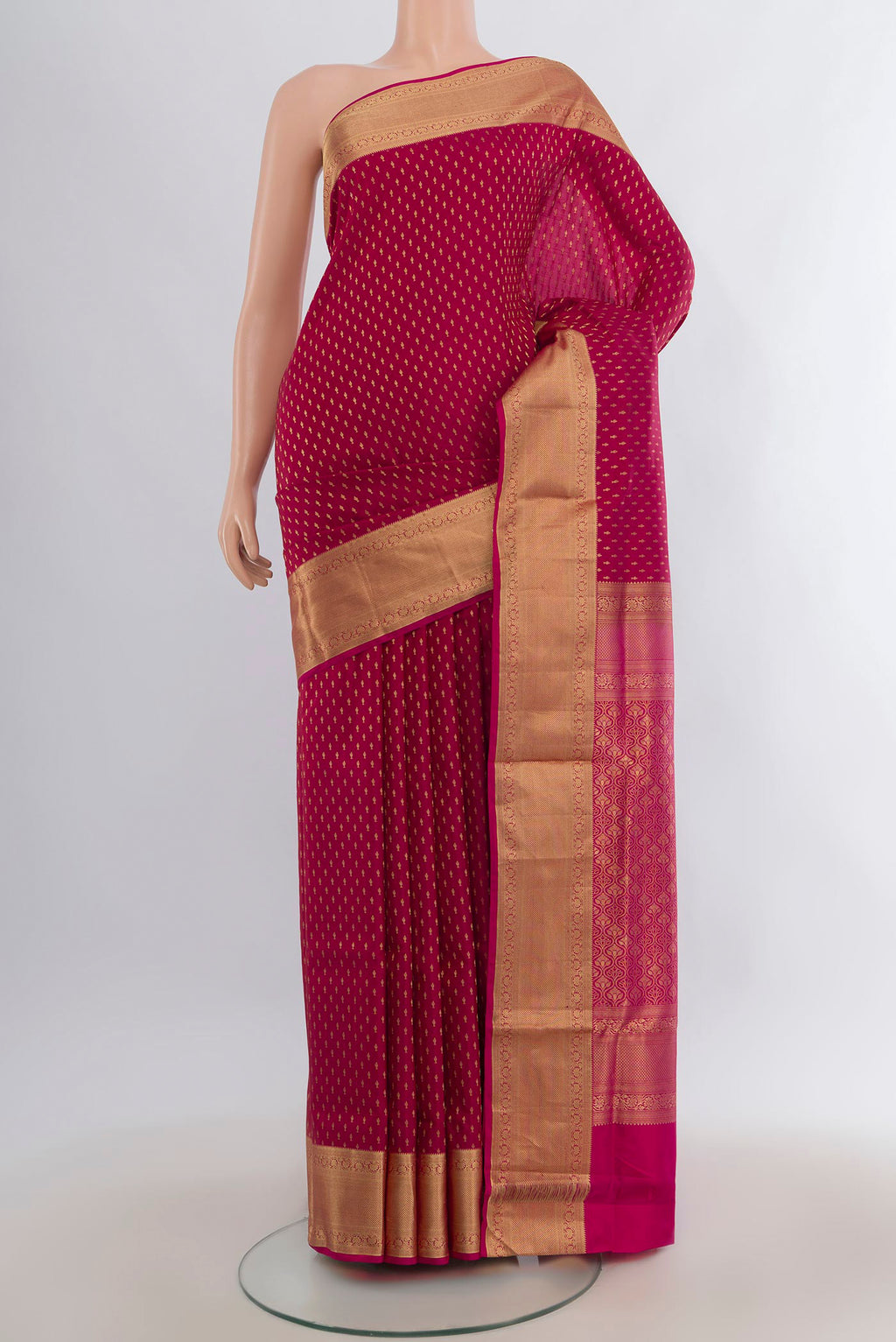 Pure Silk Maroon Soft Saree with Zari Butta on the body and Zari Border.  displayed on a mannequin