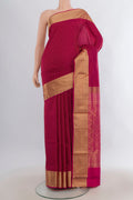 Pure Silk Maroon Soft Saree with Zari Butta on the body and Zari Border.  displayed on a mannequin