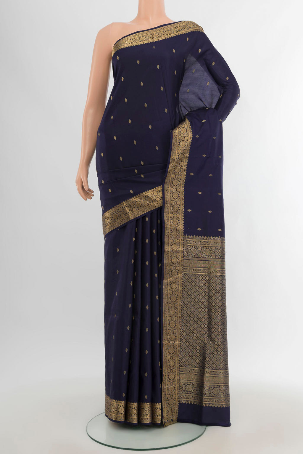 Navy Blue Soft Silk Saree with Zari Butta on the body and Zari Border.  displayed on a mannequin