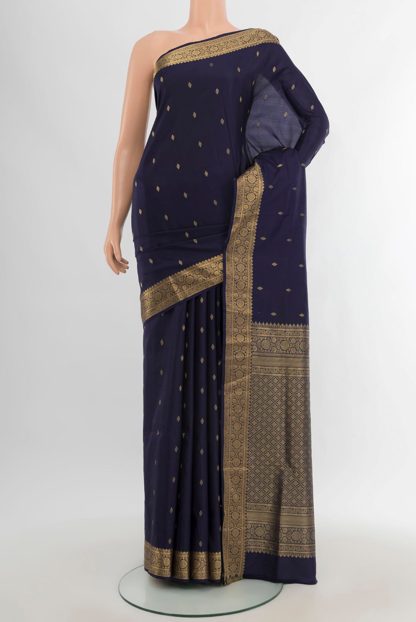Navy Blue Soft Silk Saree with Zari Butta on the body and Zari Border.  displayed on a mannequin