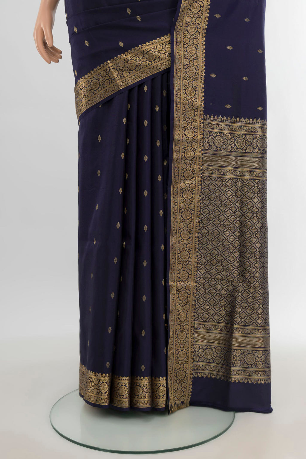 Pleats and pallu of Navy Blue Soft Silk Saree with Zari Butta on the body and Zari Border. 
