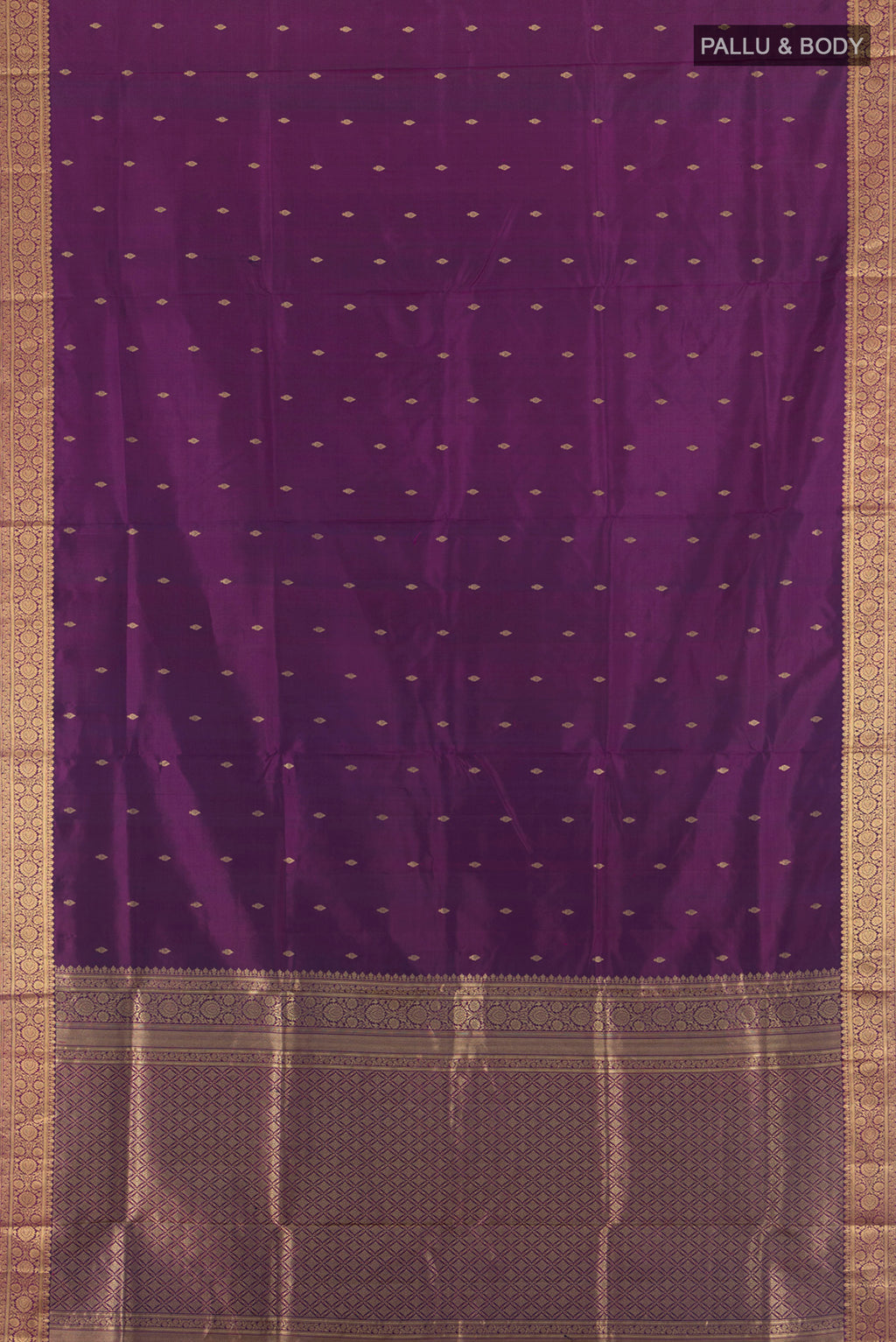 Flat view of Purple Soft Silk Saree with Zari Butta on the body and Zari Border. 