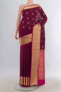 Pure Silk Maroon Soft Saree with Zari Butta on the body and Zari Border.  displayed on a mannequin