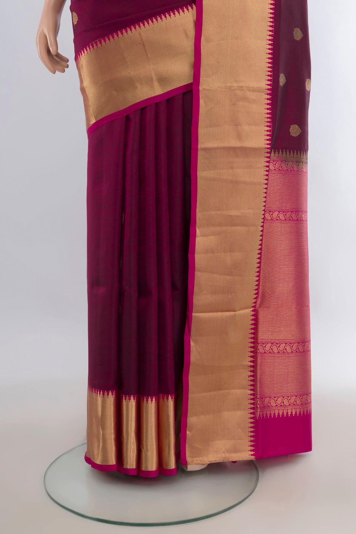 Pleats and pallu of Pure Silk Maroon Soft Saree with Zari Butta on the body and Zari Border. 