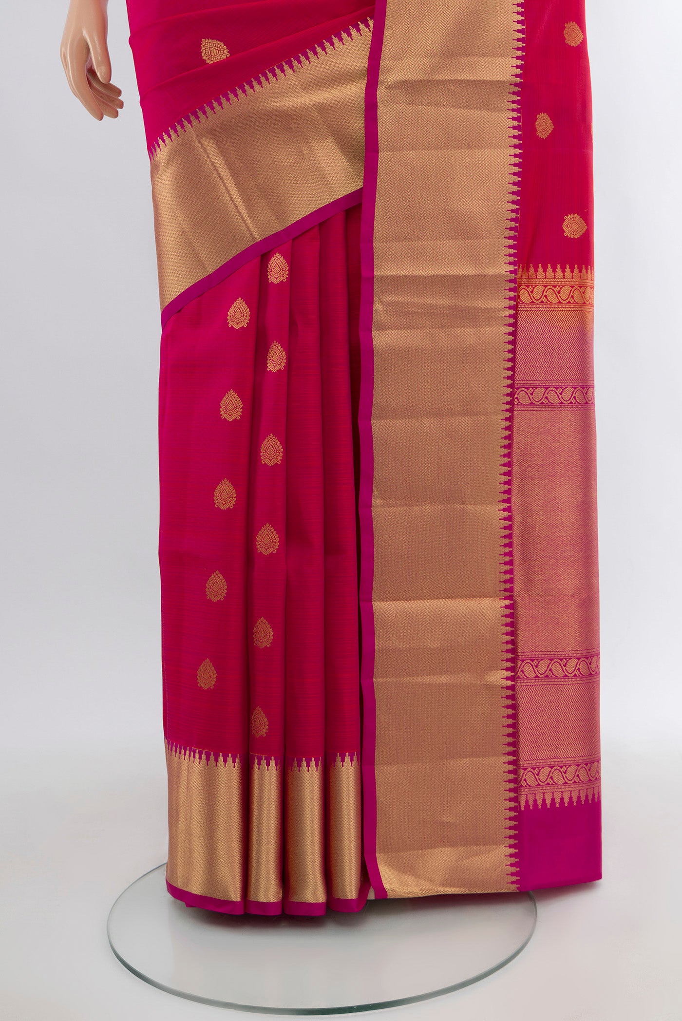 Pleats and pallu of Pink Kanjivaram Silk Saree with Zari Butta on the body and Zari Border. 
