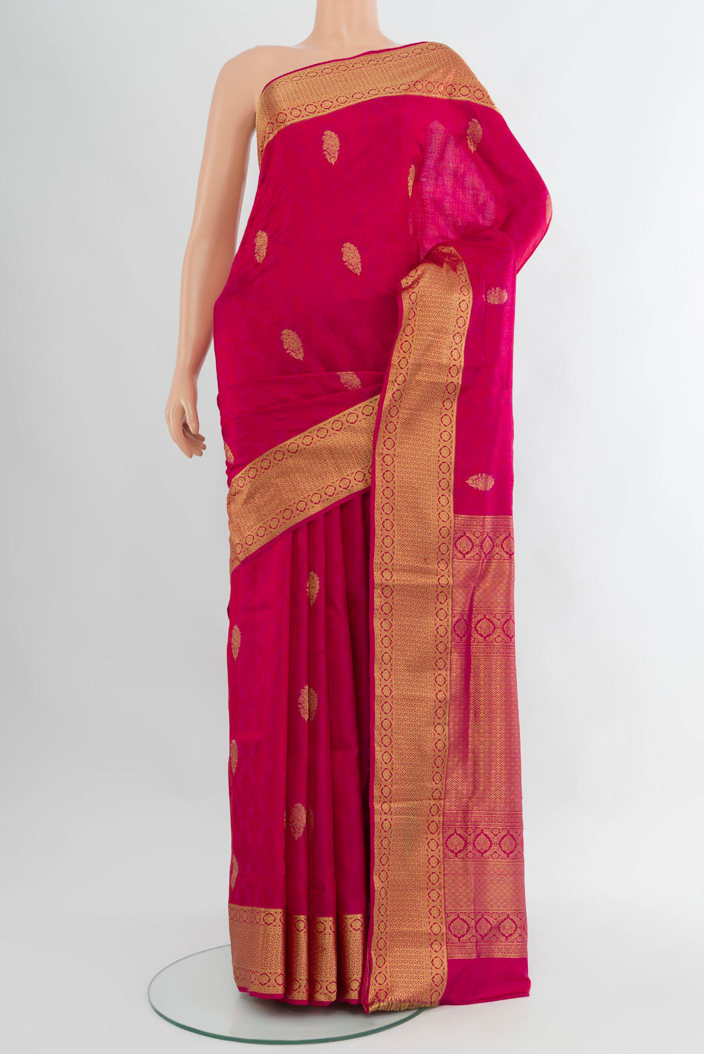 Pink Soft Silk Saree with Zari Butta on the body and Zari Border.  displayed on a mannequin