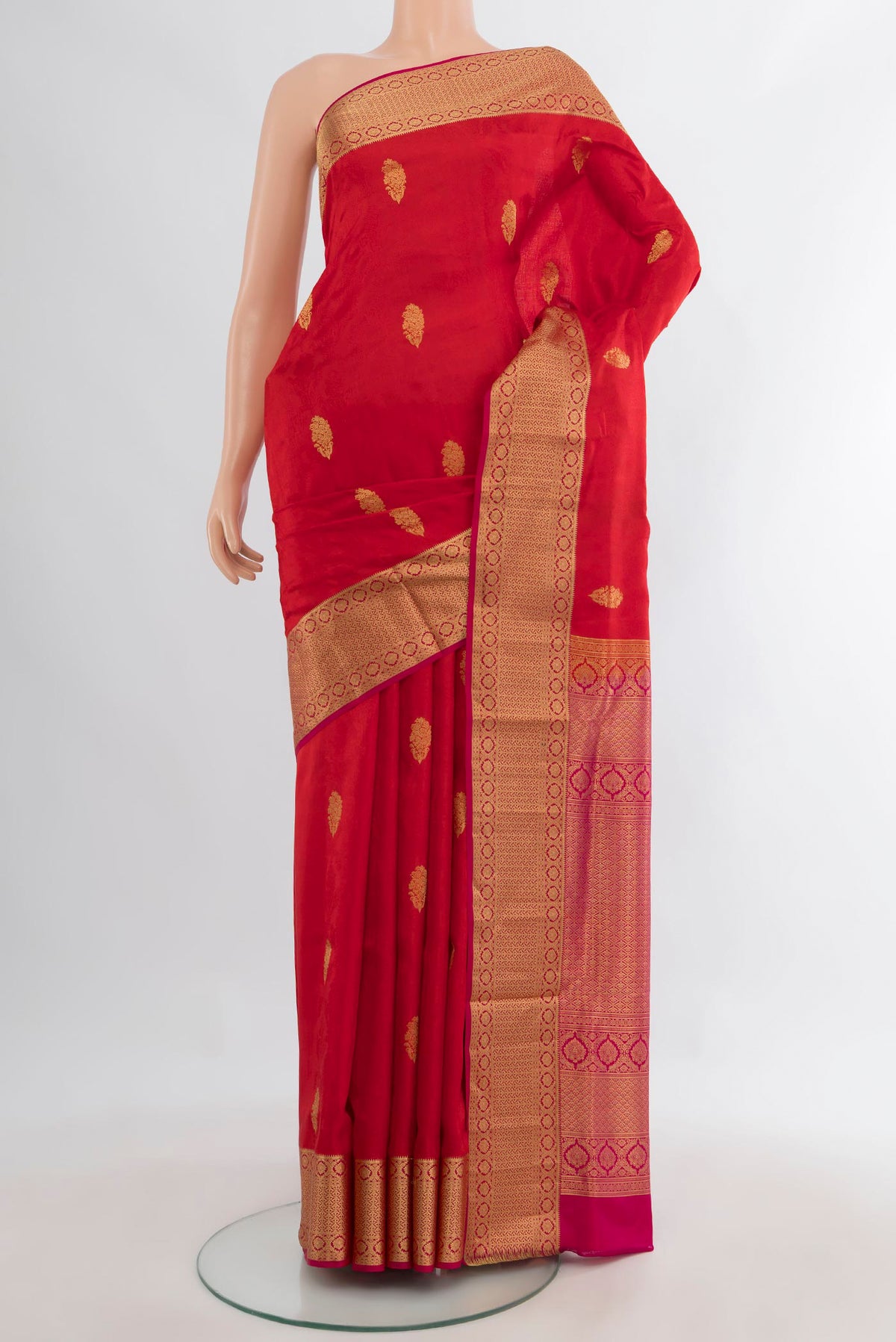 Pure Silk Red Soft Saree with Zari Butta on the body and Zari Border.  displayed on a mannequin