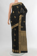 Black Soft Silk Saree with Zari Butta on the body and Zari Border.  displayed on a mannequin