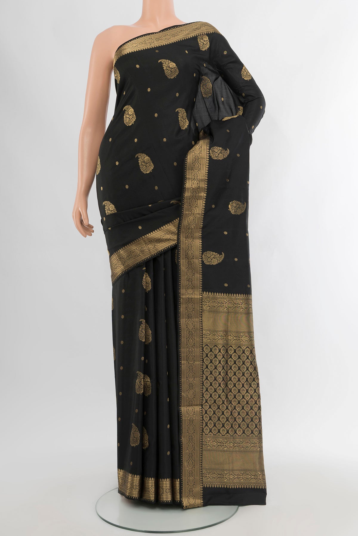 Black Soft Silk Saree with Zari Butta on the body and Zari Border.  displayed on a mannequin