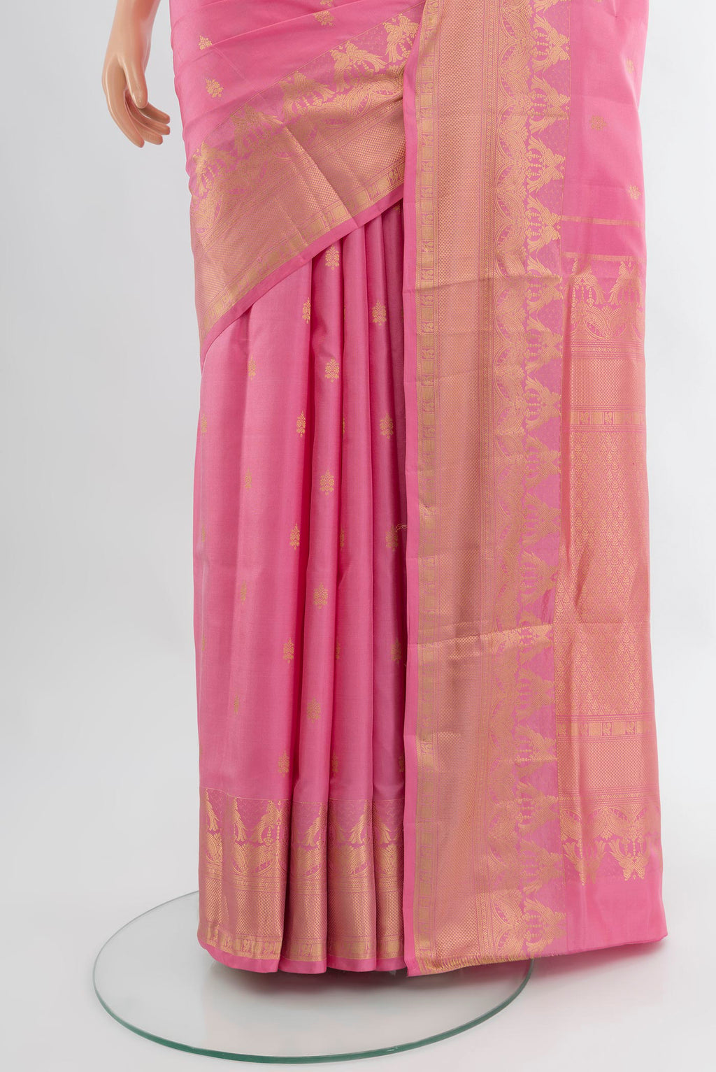 Pleats and pallu of Rose pink Soft Silk Saree with Zari Butta on the body and Fancy Border. 