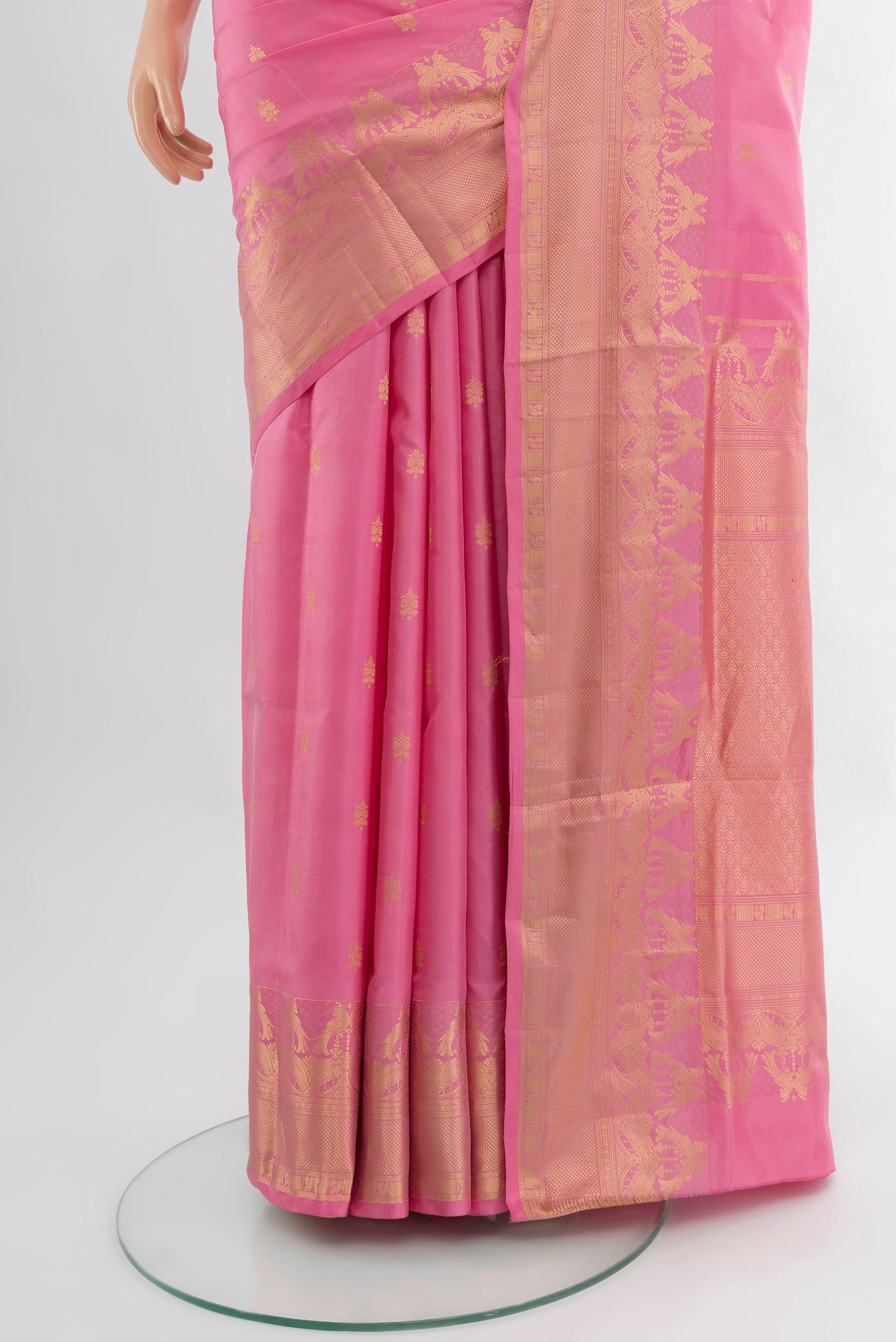 Pleats and pallu of Rose pink Soft Silk Saree with Zari Butta on the body and Fancy Border. 
