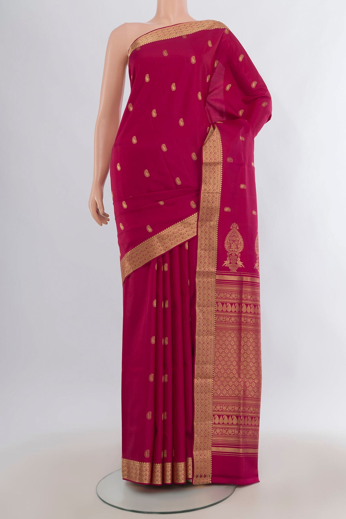 Pure Silk Dark Pink Soft Saree with Zari Butta on the body and Zari Border.  displayed on a mannequin