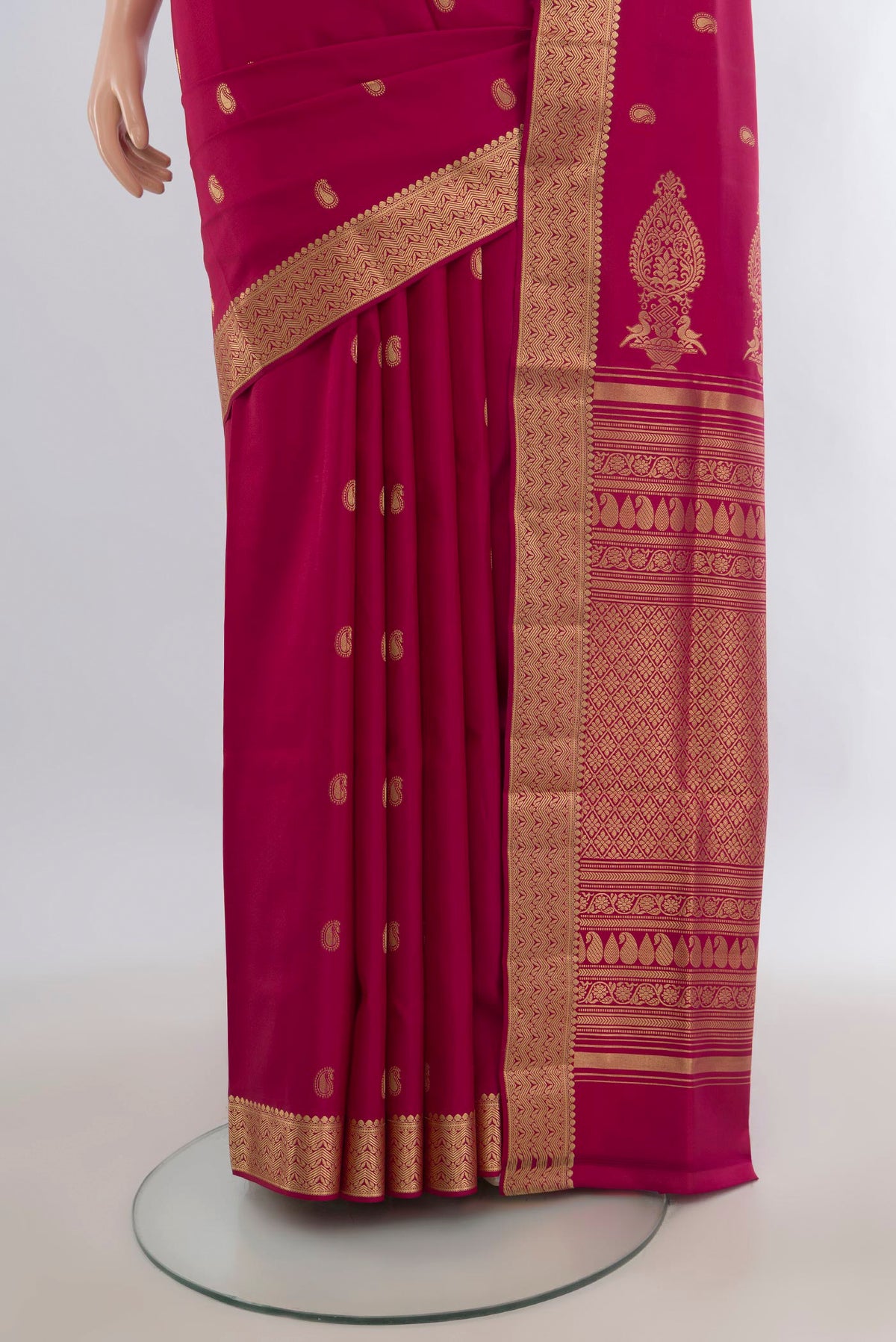Pleats and pallu of Pure Silk Dark Pink Soft Saree with Zari Butta on the body and Zari Border. 