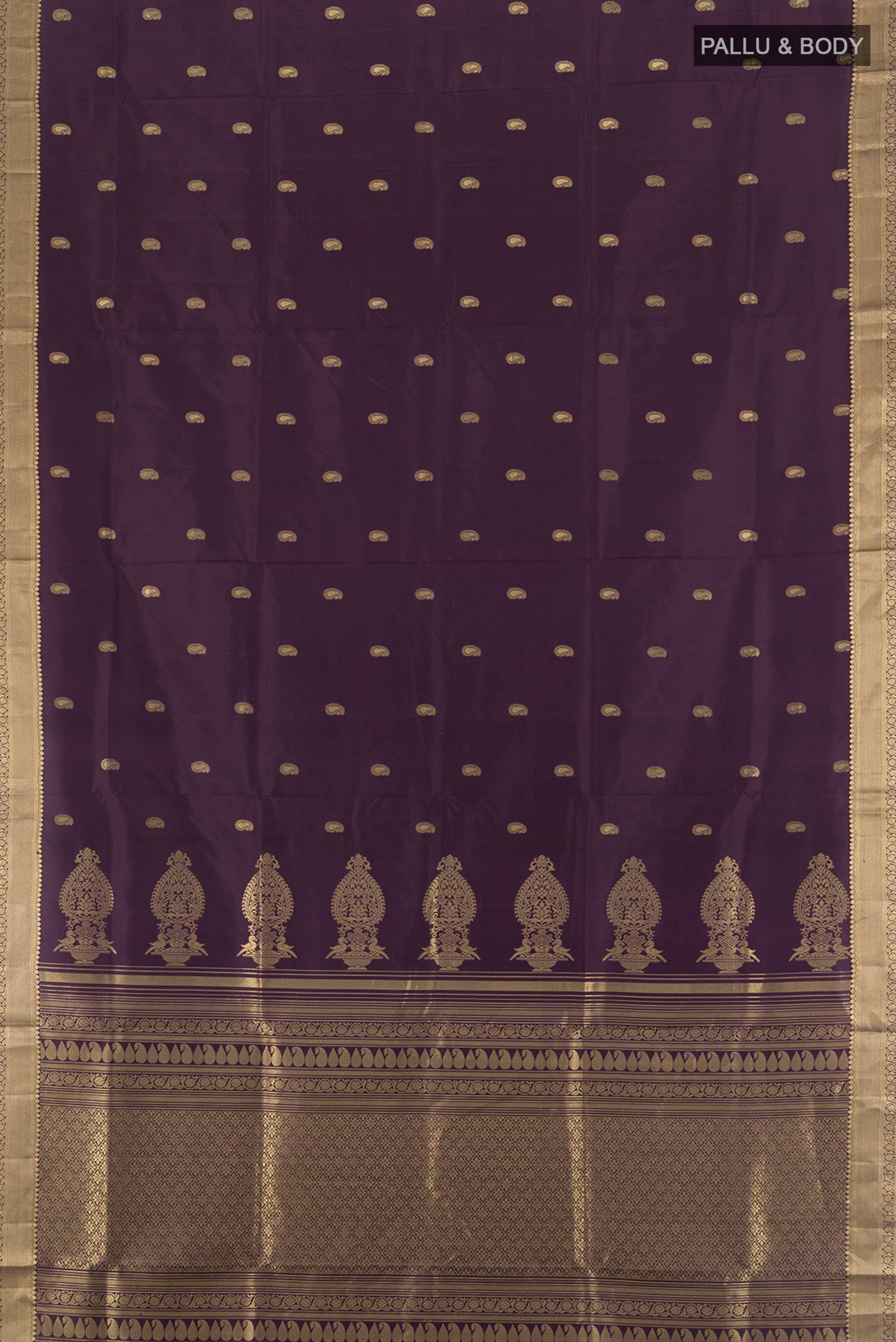 Flat view of Violet Soft Silk Saree with Zari Butta on the body and Zari Border. 