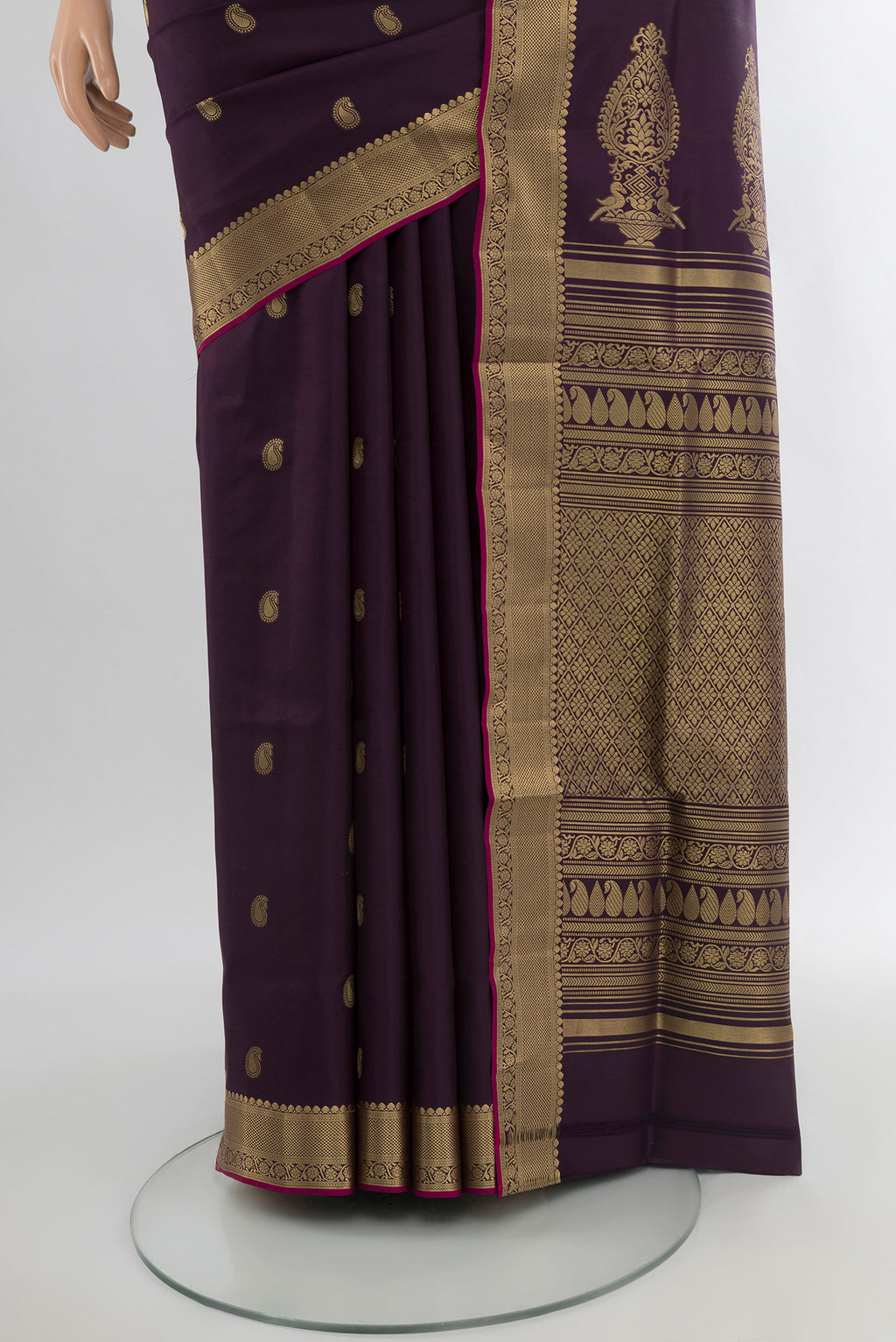 Pleats and pallu of Violet Soft Silk Saree with Zari Butta on the body and Zari Border. 